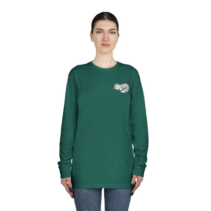 Sleepy Kitty snuggled up with her favorite Dino Plushie - Unisex Graphic Long Sleeve Tee